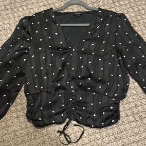 Black v neck top with white hearts and glitter stitching, size large